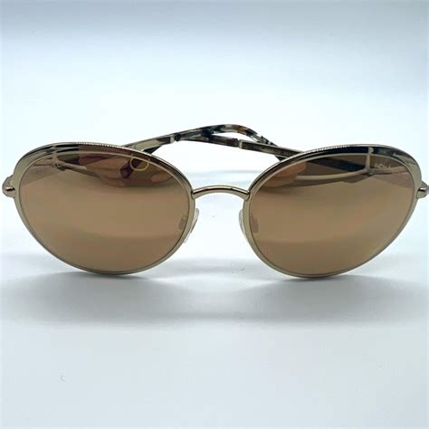 chanel sunglasses gold frame.